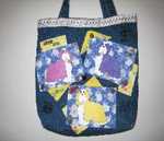 Denim Tote Bag
A mixed medium of fabric and paint make up this denim tote bag.  Dog themed buttons
and embellishments add to the finishing touches.
Tote Bag ~ $35.00